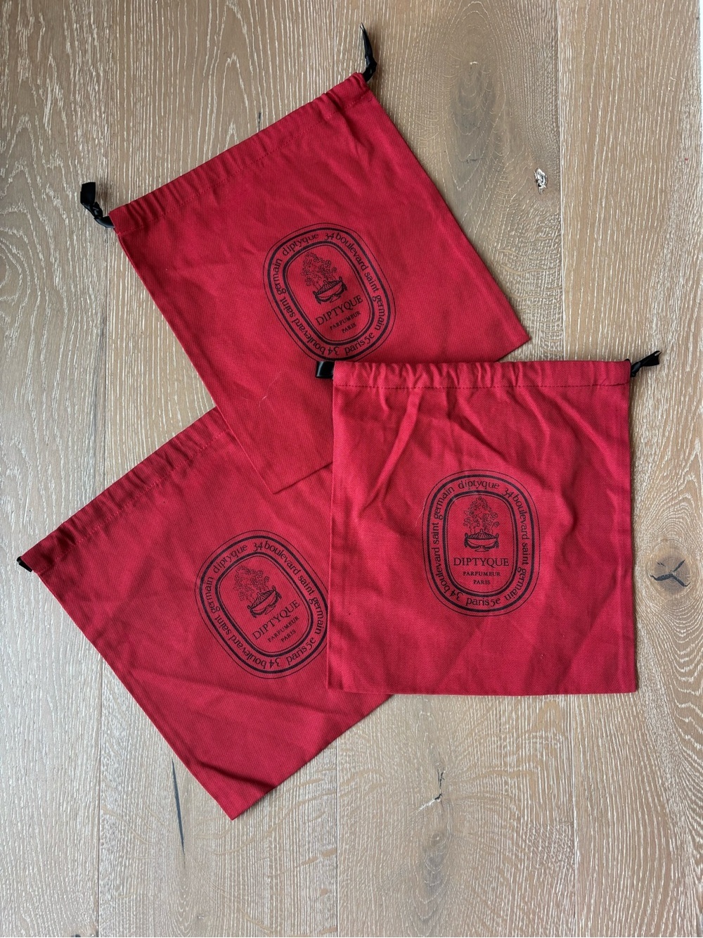diptyque Red Drawstring Pouches with Black Oval Logo